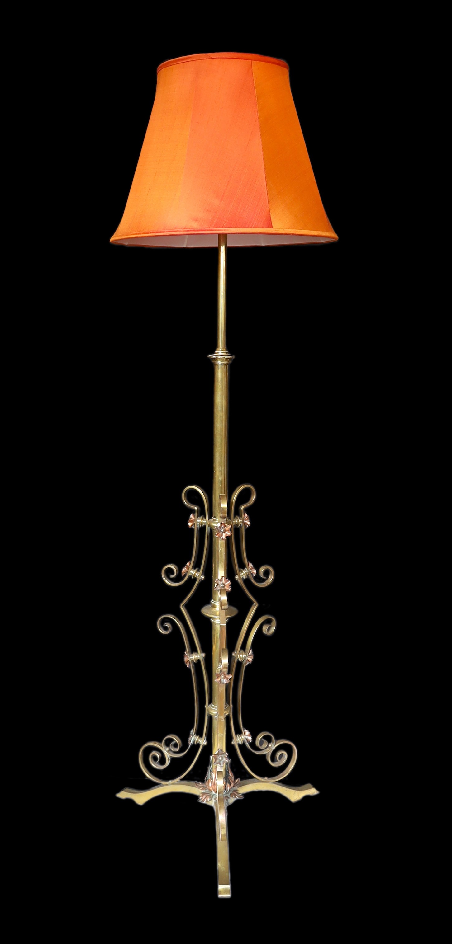 A late 19th century English brass and copper telescopic lamp standard, converted to electricity, height 148cm. width of base 50cm.